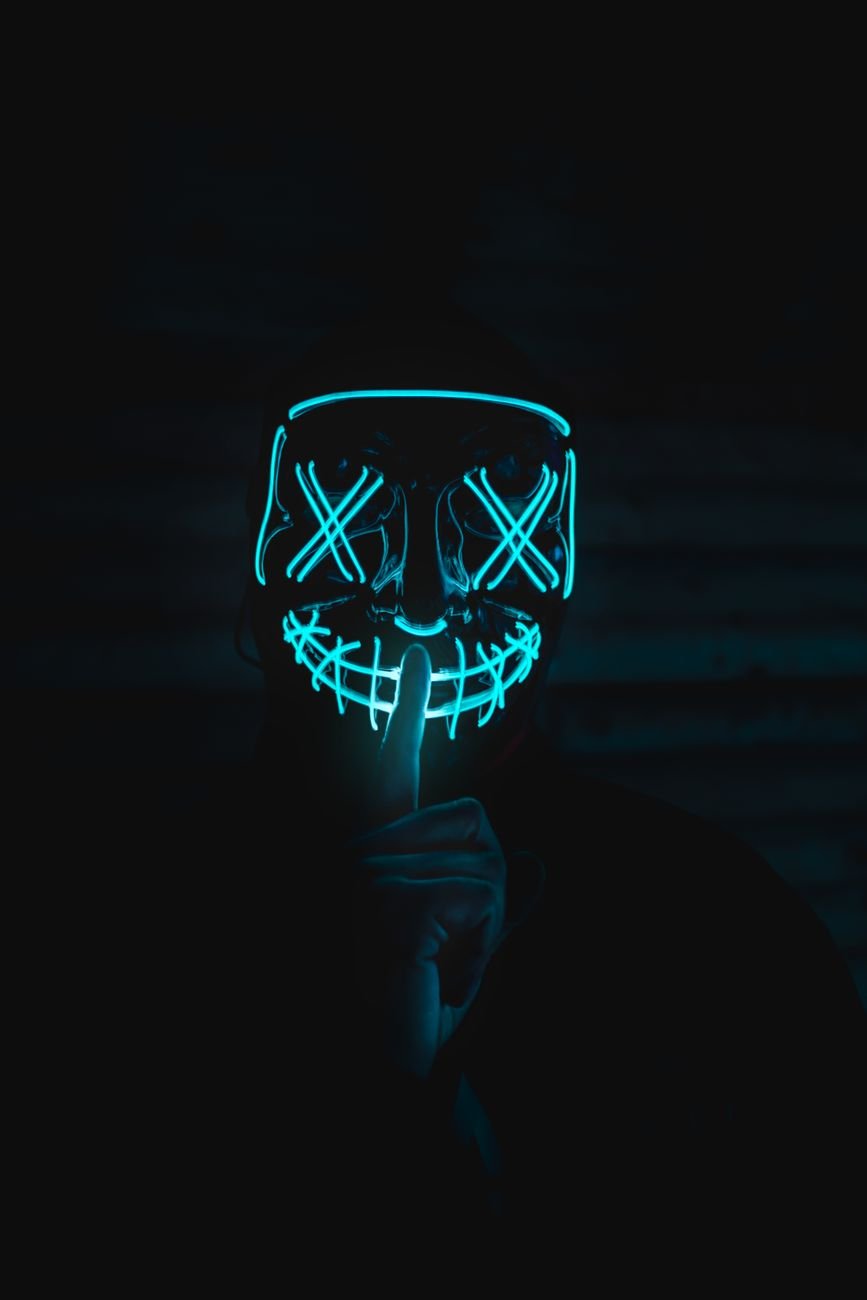 a person in a neon mask